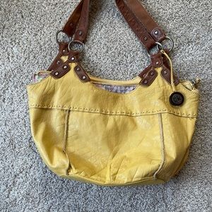 The SAK Indio Yellow Leather with Brown Leather Straps and metal hardware Purse